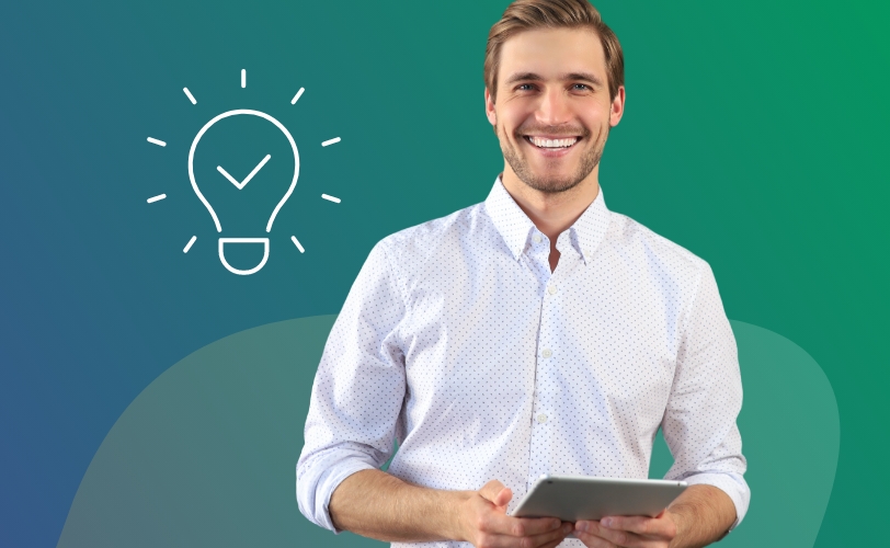 A man smiling and holding a tablet next to a lightbulb icon.