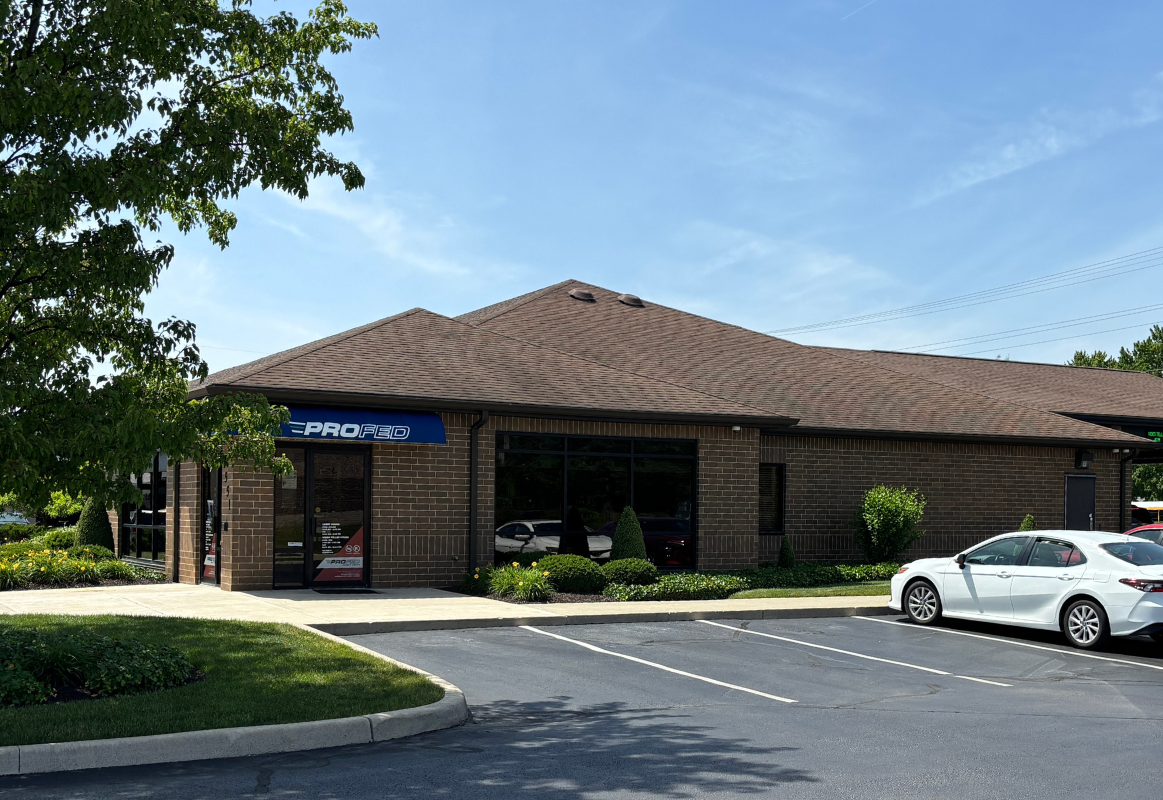 An image of the Dupont branch with a car in the parking lot.