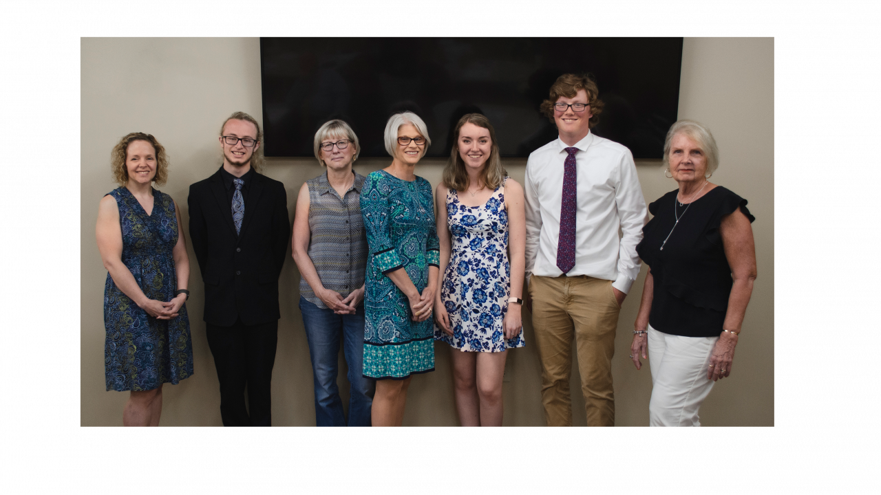 ProFed scholarship recipients standing in a line that were awarded the Carroll R. Phillips and Robert A. Weaver awards.