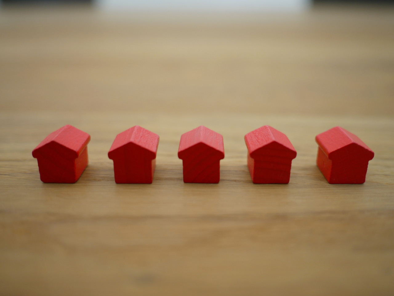 A row of wooden miniature houses.