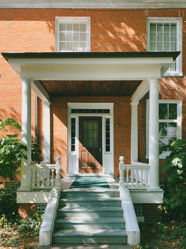 The exterior of a brick house.